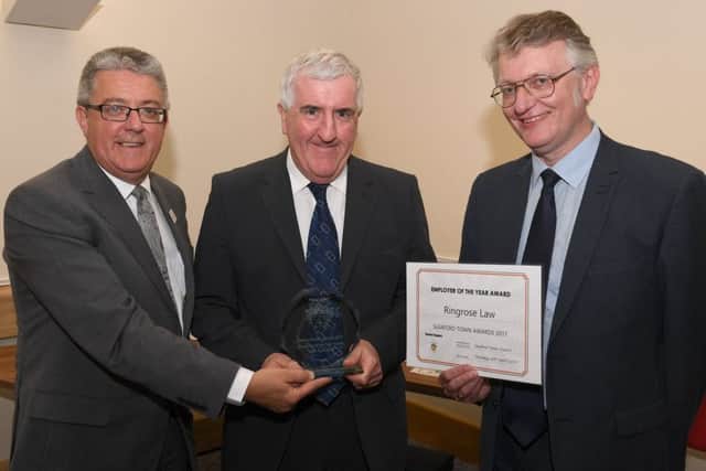 Sleaford Town Awards 2017. Employer of the Year, Ringrose Law, presented by Town Clerk Kevin Martin. EMN-170424-100737001