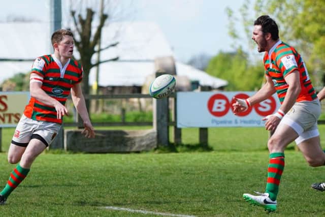 Dan Robinson (left), who had another good afternoon, finds Josh White EMN-170424-151019002