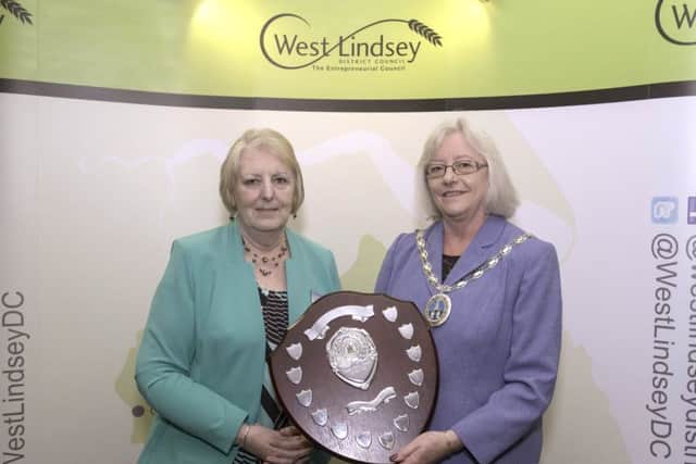 West Lindsey Community Awards 2017, pictured is Mayor of Caister recieving the shield for Parish Council of the Year from Coun Sheila Bibb EMN-170425-115407001