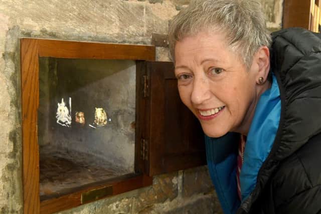 Heckington parish church hosting a special exhibition. Linda Hayes of Heckington looking at Heckington Gargoyles projections. EMN-170105-141912001