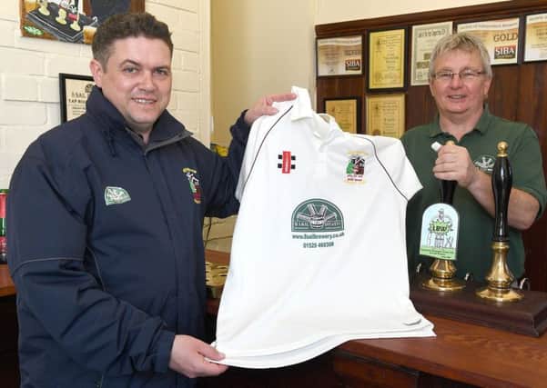 Heckington Cricket Club's new kit sponsor, 8 Sail Brewery. They have also brewed a special beer for them. From left - Heckington cricket captain Tony Carter with 8 sail brewery owner Tony Pygott. EMN-170205-112050001
