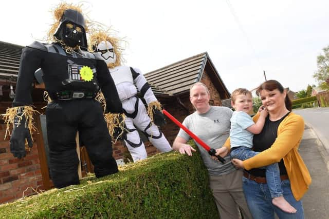 Boat gathering and scarecrows at Southkyme. Robert Church, and Jo Sharp with Henry Butcher 3 with their scarecrows. EMN-170105-135759001