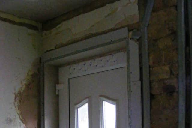 Plasterwork is needing to be completed and painted around the new doorway. EMN-170428-112048001