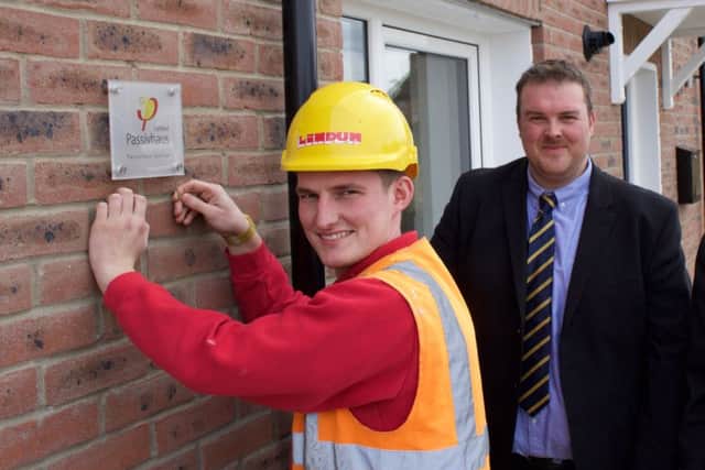 Making finishing touches to the new environmentally friendly Passivhauses built at Heckington on Welchman Way. EMN-170428-170126001