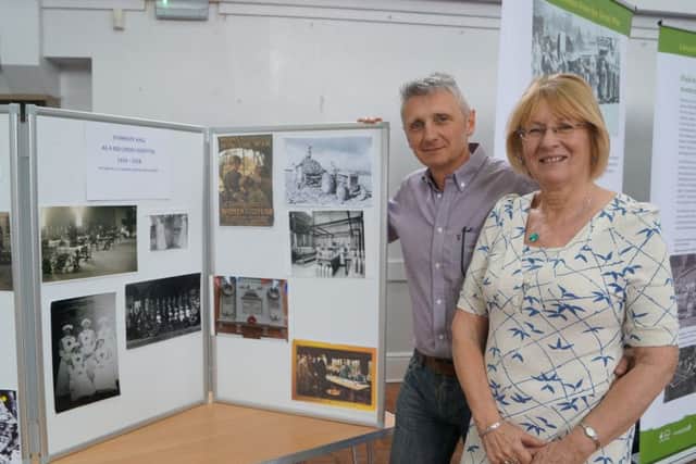 Mary and Gordon Silverton with some of the Horncastle pictures EMN-170105-094630001
