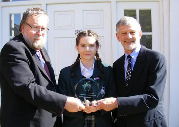 Fiona Lucas receives her Junior Sports Individual Award from Mayor of Sleaford Coun David Suiter and sponsor Clive Wicks. EMN-170805-172348001