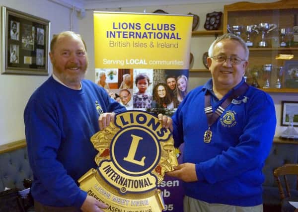 Outgoing Lions President John Fox, right, hands over the role to Gary Eastburn at their new venue, Rase Park. EMN-170516-084001001