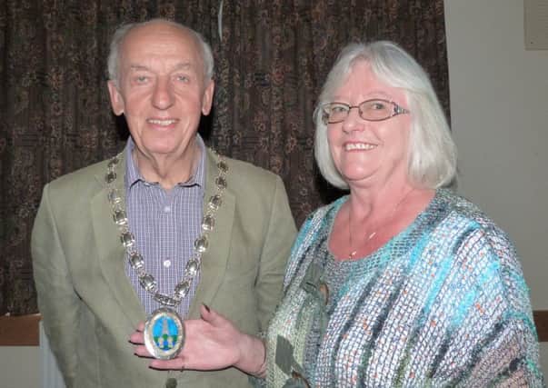 Caistor councillor Carol Mackenzie has handed over the mayoral chain of office to Councillor Alan Somerscales EMN-170515-121848001