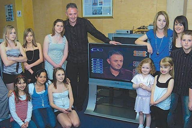 Paul tunes into the show with members of his family in 2007.