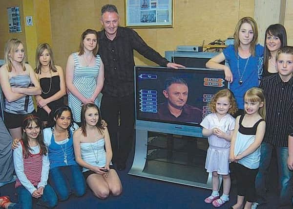 Paul tunes into the show with members of his family in 2007.