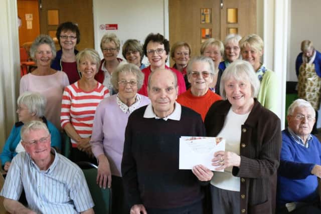 Members of The Meridian Singers groups presented a cheque of £1,578 to the dementia group based at The Trinity Centre in Louth.