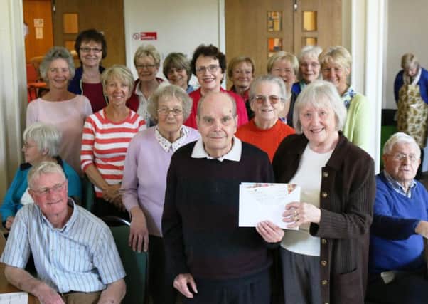 Members of The Meridian Singers groups presented a cheque of Â£1,578 to the dementia group based at The Trinity Centre in Louth.