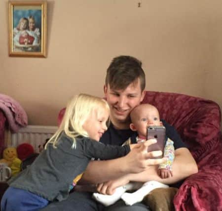 Lucas Holness with his two nieces, Phoebe and Georgie.