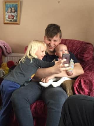 Lucas Holness with his two nieces, Phoebe and Georgie.