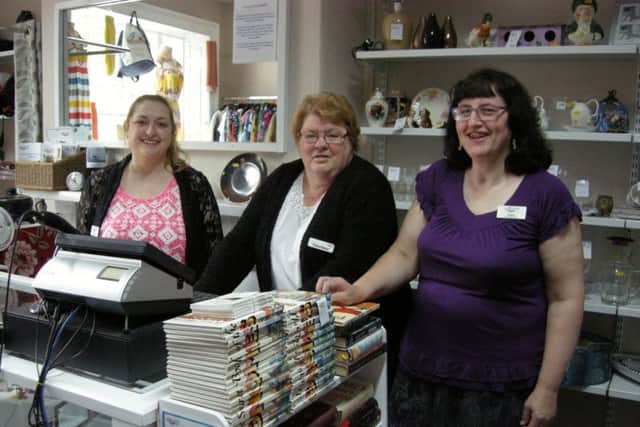Staff members at the newly refurbished shop in the Market Place