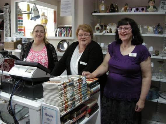 Staff members at the newly refurbished shop in the Market Place
