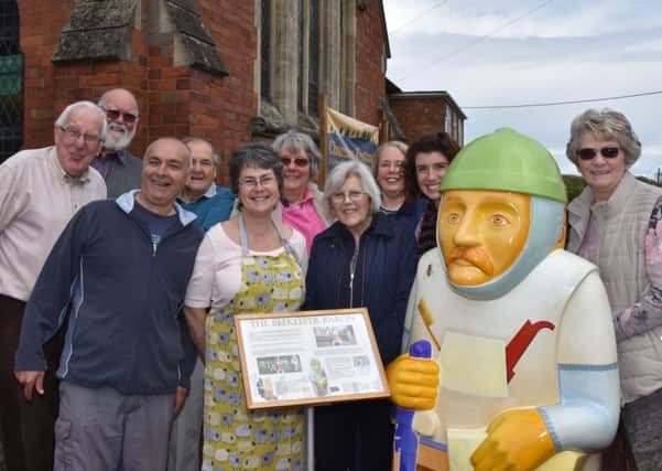 Helpers and visitors stand with Beekeeper Baron at Wragby Methodist Church during the open weekend EMN-170522-094653001