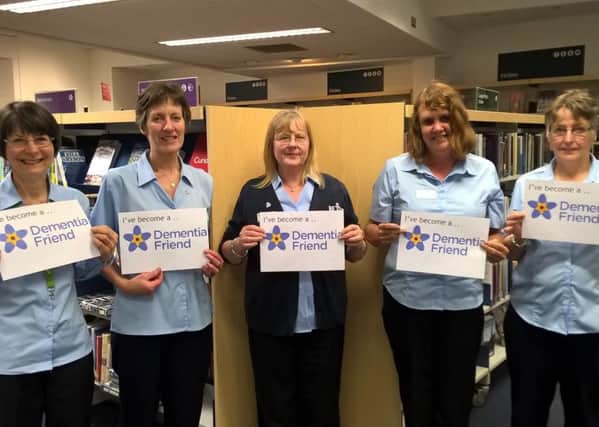 Sleaford Library staff supporting Dementia Awareness Week. EMN-170517-104209001