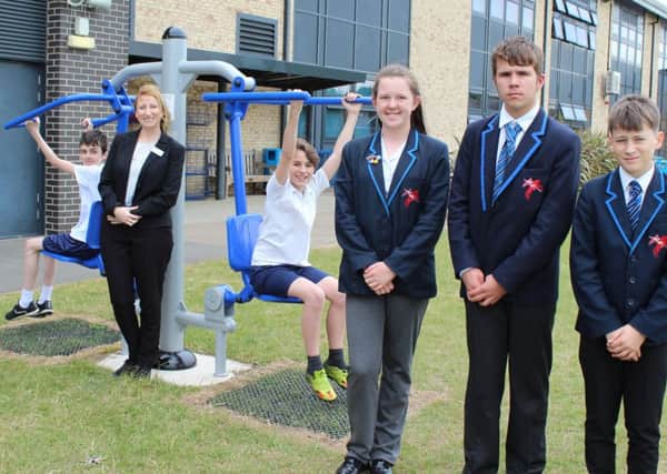 St George's Academy Vice-Principal and and Head of Ruskington Campus, Claire Adams with students and the new gym equipment. EMN-170519-112506001