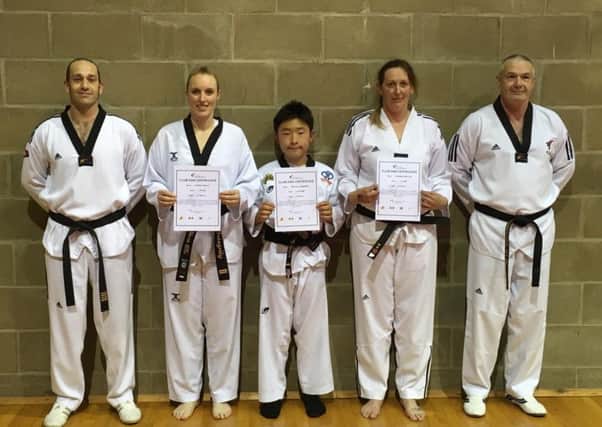 From left, instructor Ian Ball with black belt trio Rosemary Metcalfe, Micheal Subberwal and Leanne Gowler and instructor Tom Ball EMN-170518-164412002