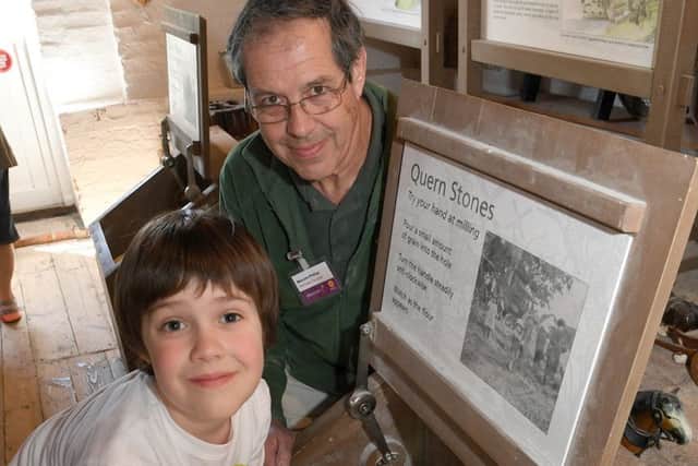 Cogglesford Mill open day for National Mills Weekend. Heritage volunteer Malcolm Phillips with Tiberius Huston 7 of Waddington. EMN-170519-164841001
