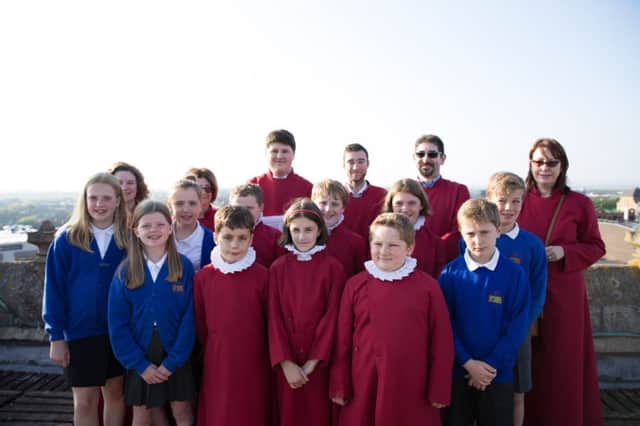 Grasby pupils and the Minster Choir atop the tower EMN-170526-074556001