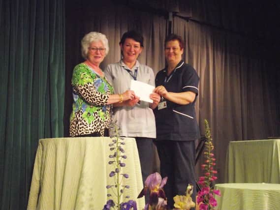 Retiring Chairman Kathy Fairburn presented St Barnabas Nurses Boston with a cheque for ?1000, a charity close to her heart,as they helped care for her late husband Jim. EMN-170206-085822001