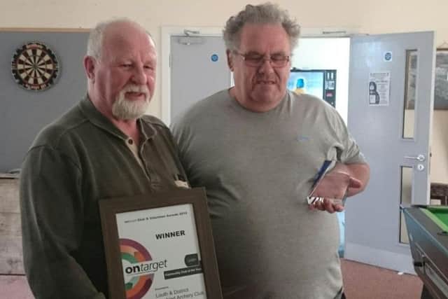 Club chairman Rick Smith (left) and senior coach Derek Burman with the award EMN-170525-124426002