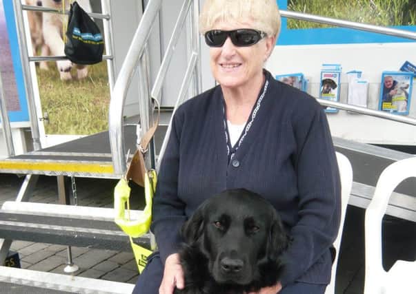 Mary Clark pictured with her previous guide dog Usher.