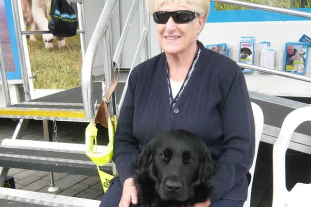 Mary Clark pictured with her previous guide dog Usher.