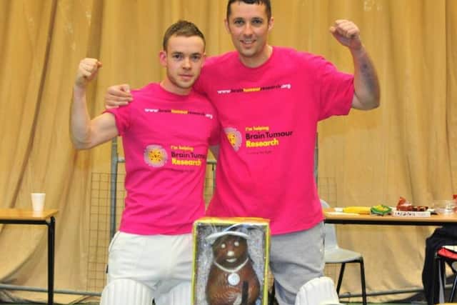 Dave Newman and Richard Wells on completion of their 48-hour cricketing marathon three years ago. EMN-170506-153100001