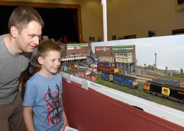 Second Sleaford and District model railway club exhibition. Jon Starbuck with Noah Starbuck 10 of Sleaford. EMN-170506-114405001