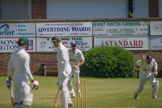 Sleaford wicket-keeper Oliver Burford safely pouches a catch, one of two taken against Grantham EMN-170530-102942002