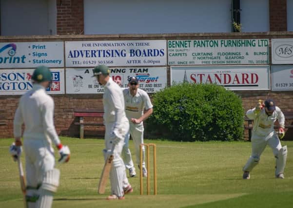 Sleaford wicket-keeper Oliver Burford safely pouches a catch, one of two taken against Grantham EMN-170530-102942002