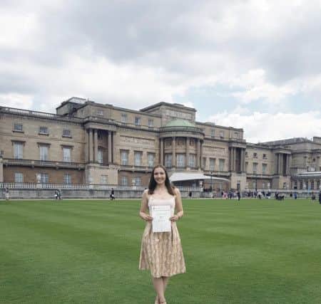 May Ashton-Jones (18) in the gardens of Buckingham Palace.