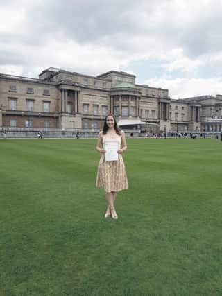 May Ashton-Jones (18) in the gardens of Buckingham Palace.