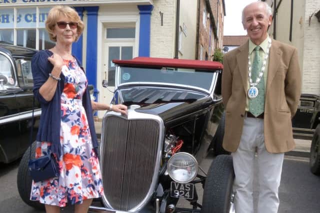 Caistor Mayor Alan Somerscales and Mayoress Gill Somerscales next to a 1934 Ford.at the town's vintage car display (picture by Linda Oxley) EMN-170531-101522001