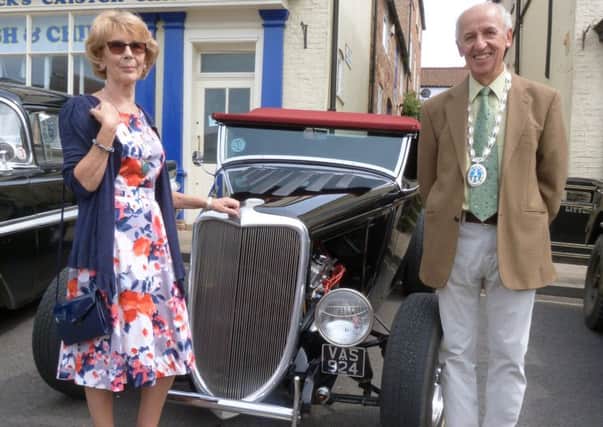 Caistor Mayor Alan Somerscales and Mayoress Gill Somerscales next to a 1934 Ford.at the town's vintage car display  (picture by Linda Oxley) EMN-170531-101522001