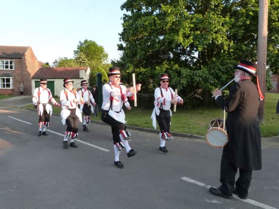 The Grimsby Morris Men performing a dance at North Kelsey at last year's blessing.  (Photo by Linda Oxley) EMN-170531-180219001