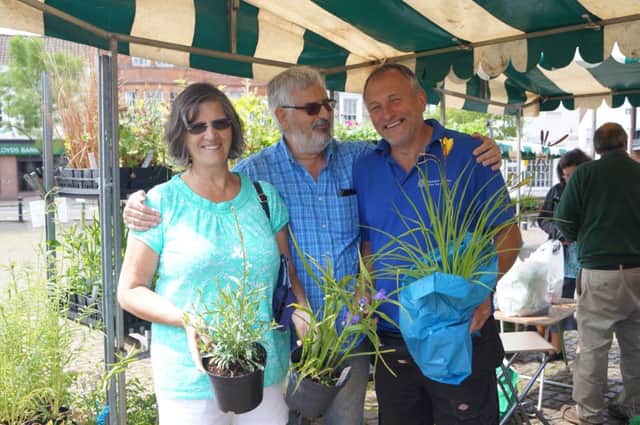 Steve Penney of Waltham Herbs with two of his many customers EMN-170406-173842001