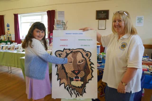 Emily Parker was one of the lucky winners on the Lions tombola stall, run by Christine Goldring EMN-170406-173907001