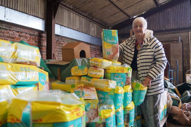 Hazel Hammond with some of the nappies which have been donated for the refugee families EMN-171206-072904001