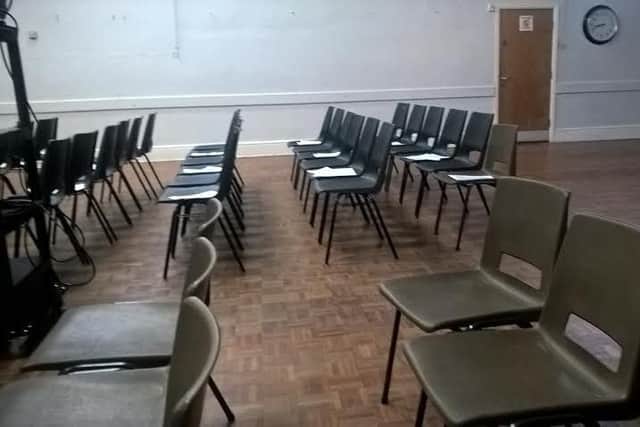 Empty chairs at town meeting