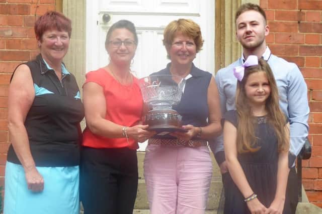 Noreen Ross Trophy winner Jo Herring (centre) with, from left, lady captain Andrea Smaggasgale, Noreen's daughter Clair Steele with children Euan and Ellie Steele EMN-170206-130650002