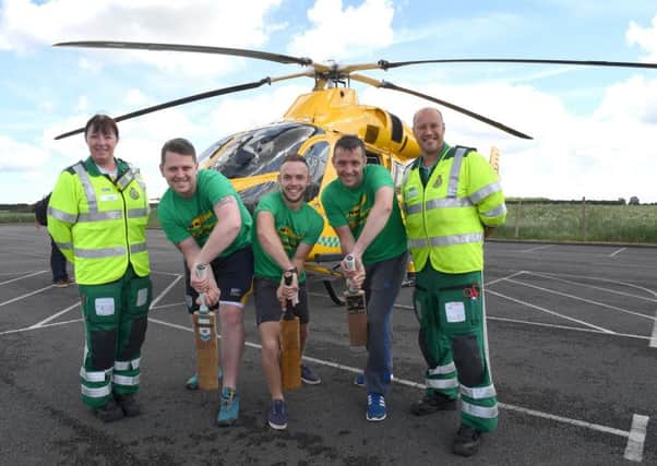 Shaun Brown, Richard Wells and Dave Newman who are going to attempt to break the record for longest indoor cricket net, raising money for Air Ambulance. L-R Jane Pattison - paramedic, Shaun, Richard, Dave, Neil Clarke - paramedic and ops manager. EMN-170506-122643001