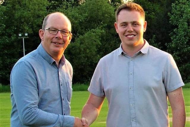 Padden (right) is pictured being welcomed to Market Rasen Town FC by club chairman Carl Adlam EMN-170506-132342002