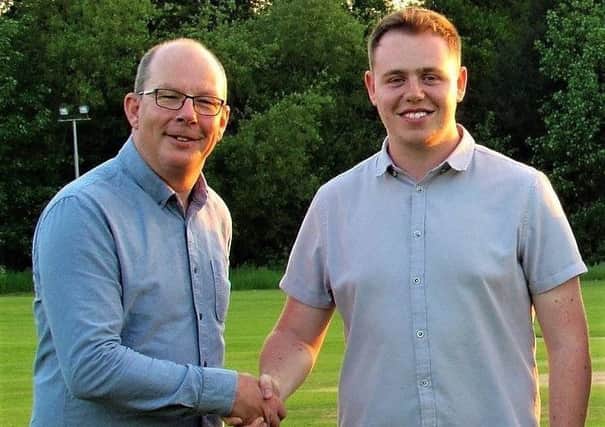 Padden (right) is pictured being welcomed to Market Rasen Town FC by club chairman Carl Adlam EMN-170506-132342002