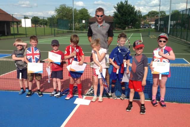 youngsters at a recent Tennis 4 Kids course with coach Karl Sutton.
