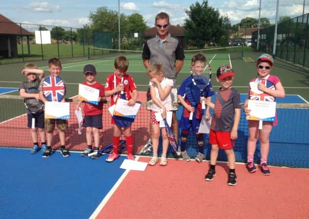 youngsters at a recent Tennis 4 Kids course with coach Karl Sutton.