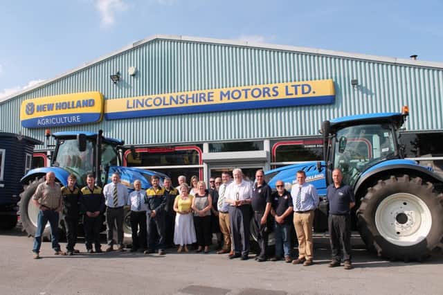 The team at Lincolnshire Motors Ltd in Fairfield Industrial Estate, Louth, with the fundraisers Philip Gibson and Peter Plehov.